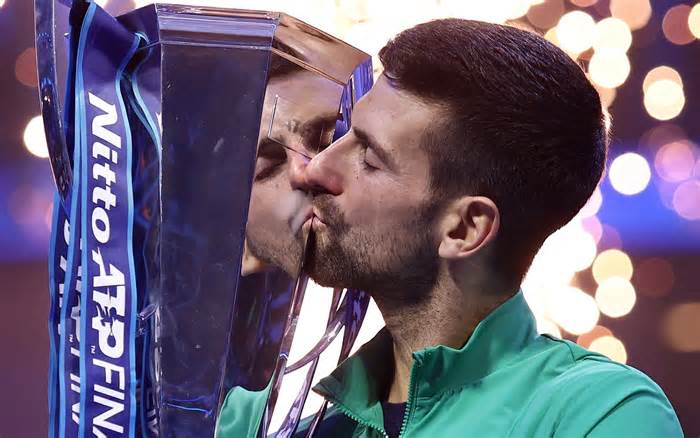 Novak Djokovic kisses the trophy