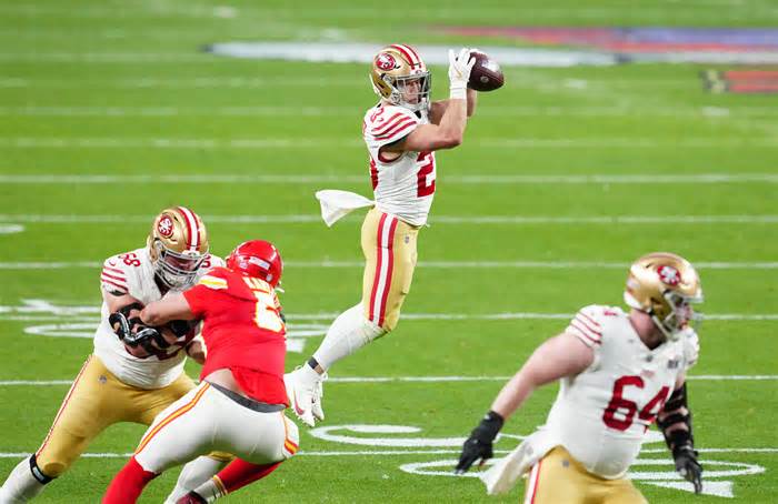 San Francisco 49ers running back Christian McCaffrey (23) catches a touchdown pass from wide receiver Jauan Jennings (not pictured) against the Kansas City Chiefs in the first half in Super Bowl LVIII at Allegiant Stadium.