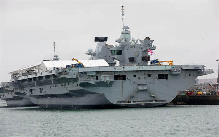 HMS Queen Elizabeth alongside in Portsmouth harbour. The carrier will need dry docking to fix propellor shaft problems