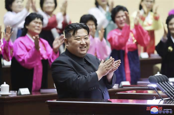 This photo provided by the North Korean government, North Korean leader Kim Jong Un applauds in the National Mothers’ Meeting in Pyongyang, North Korea on Dec. 3, 2023. Independent journalists were not given access to cover the event depicted in this image distributed by the North Korean government. The content of this image is as provided and cannot be independently verified. Korean language watermark on image as provided by source reads: 