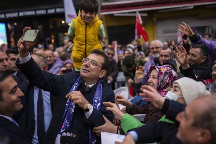 Ekrem Imamoglu takes photos with supporters during a campaign rally in Istanbul last month.