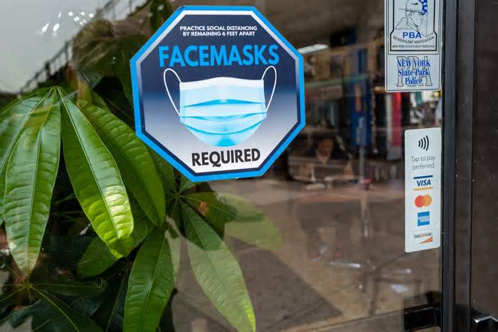 A face mask sign is displayed