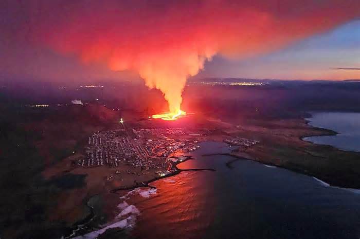 TOPSHOT - Billowing smoke and flowing lava are seen in this Icelandic Department of Civil Protection and Emergency Management , January 14, 2024, handout image during an volcanic eruption on the outskirts of the evacuated town of Grindavik, western Iceland. Seismic activity had intensified overnight and residents of Grindavik were evacuated, Icelandic public broadcaster RUV reported. This is Iceland's fifth volcanic eruption in two years, the previous one occurring on December 18, 2023 in the same region southwest of the capital Reykjavik. Iceland is home to 33 active volcano systems, the highest number in Europe. (Photo by Icelandic Department of Civil Protection and Emergency Management / AFP) (Photo by ICELANDIC DEPARTMENT OF CIVIL PROTECTION AND EMERGENCY MANAGEMENT/AFP via Getty Images)