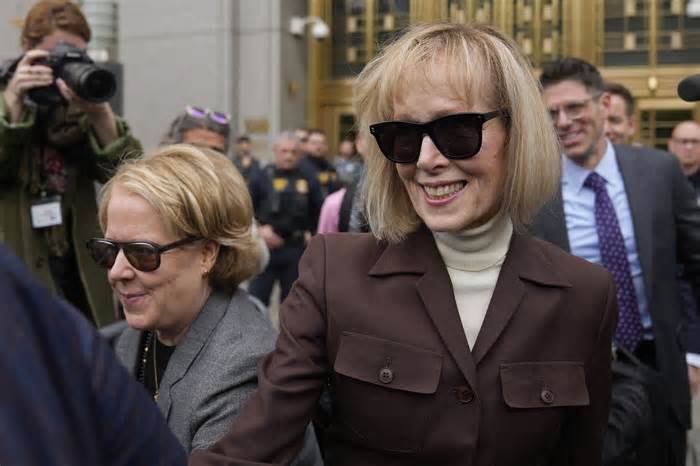 FILE - E. Jean Carroll, right, walks out of Manhattan federal court, May 9, 2023, in New York. The notorious 2005 “Access Hollywood” video in which Donald Trump was caught on a hot mic speaking disparagingly about women over a decade before he became president can be shown to jurors deciding what he owes Carroll, a columnist he defamed, a federal judge ruled Tuesday, Jan. 9, 2024, as he set up ground rules for a trial next week. (AP Photo/Seth Wenig, File)