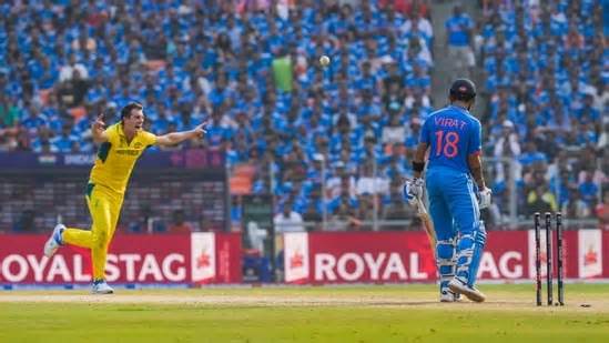 India's Virat Kohli is bowled out by Australia captain Pat Cummins in the World Cup final.