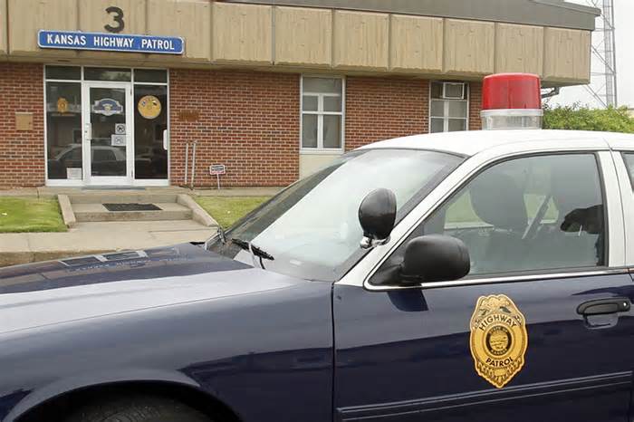 FILE - A Kansas Highway Patrol retro patrol car is parked outside their headquarters, April 5, 2012, in Wichita, Kan. The Kansas Highway Patrol must stop using a tactic known as the “Kansas Two-Step” to detain out-of-state drivers long enough to find a reason to search their vehicles for illegal drugs, a federal judge ruled Monday, Nov. 20, 2023. (Fernando Salazar/The Wichita Eagle via AP, File)