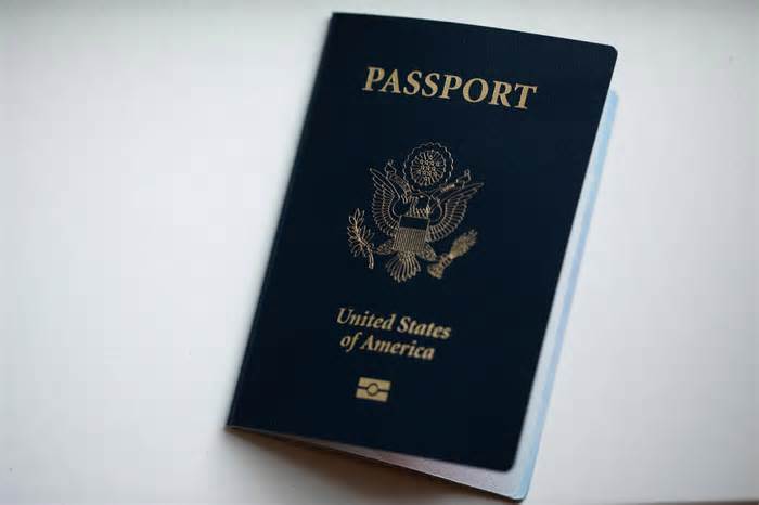 The cover of a U.S. Passport is displayed in Tigard, Ore., Saturday, Dec. 11, 2021.