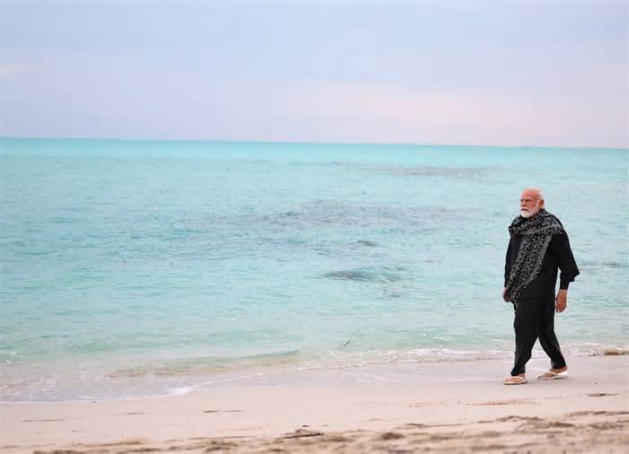 In this photograph released on Indian Prime Minister Narendra Modi's social media platform X on Jan.4, 2024, Modi, walks on a beach in Lakshadweep, India. Relationship between India and the Maldives is facing challenges after officials in the tiny island nation made derogatory remarks against Prime Minister Narendra Modi’s posts that promoted the pristine beaches of India’s Lakshadweep archipelago. (Narendra Modi's social media platform X via AP)