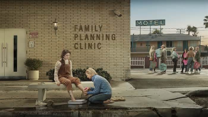 An image from the polarizing “He Gets Us” ad campaign depicts an anti-abortion protester washing the feet of a pregnant clinic visitor.