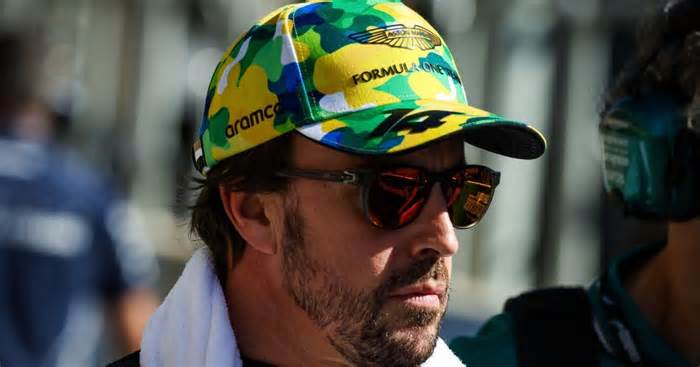 Fernando Alonso wearing shades and cap.