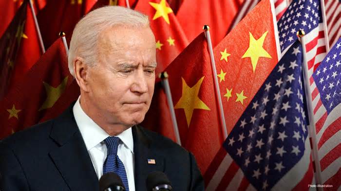 President Biden in front of American and Chinese flags