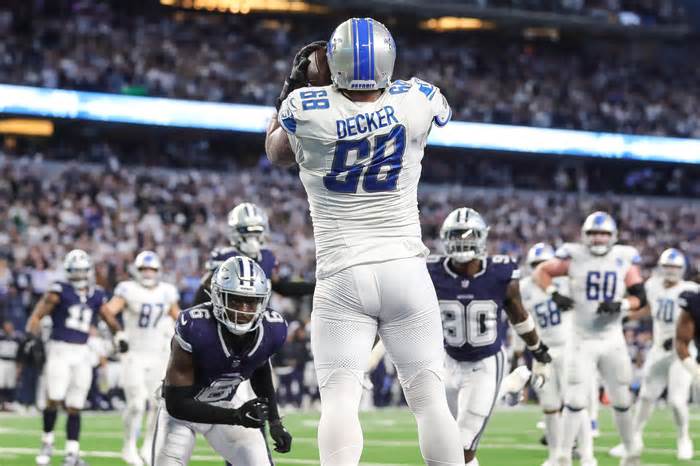 Detroit Lions offensive tackle Taylor Decker (68) catches the ball in the end zone for a 2-point conversion against Dallas Cowboys during the second half at AT&T Stadium in Arlington, Texas on Saturday, Dec. 30, 2023. The play was flagged for illegal touching.