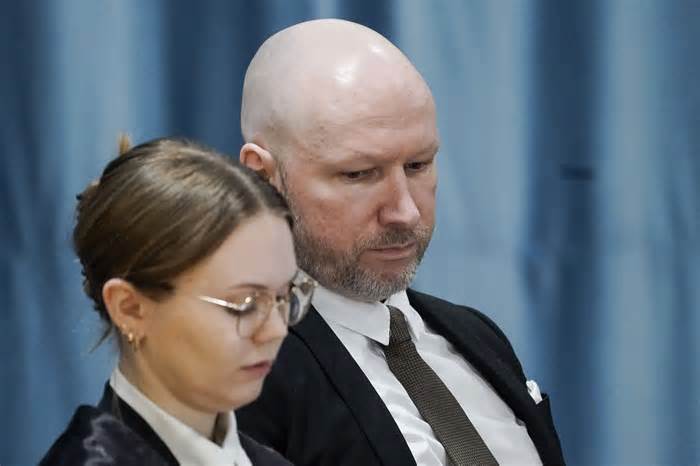 Anders Behring Breivik and attorney Marte Lindholm sits, as the Oslo district court conducts his case in a gymnasium at Ringerike prison, in Ringerike, Norway, Monday, Jan. 8, 2024. Breivik, who slayed 77 people in an anti-Islamic bomb and gun rampage in 2011, appeared in court on Monday in a bid to sue the Norwegian state for breaching his human rights. Norway’s worst peacetime killer says his solitary confinement since being jailed in 2012 amounts to inhumane treatment under the European Convention of Human Rights. (Cornelius Poppe/NTB Scanpix via AP)