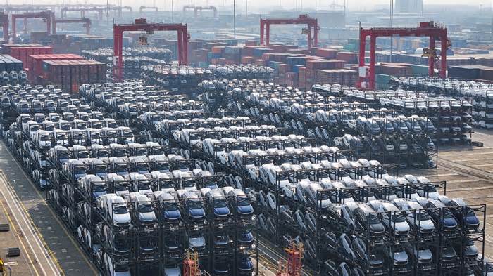 BYD electric cars waiting to be loaded onto a ship are seen stacked at the international container terminal of Taicang Port in Suzhou, China