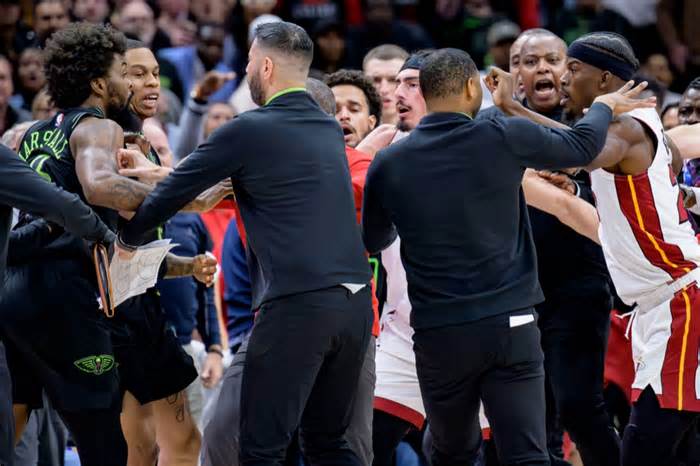 Naji Marshall, left, and Jimmy Butler, right, are separated during the scuffle
