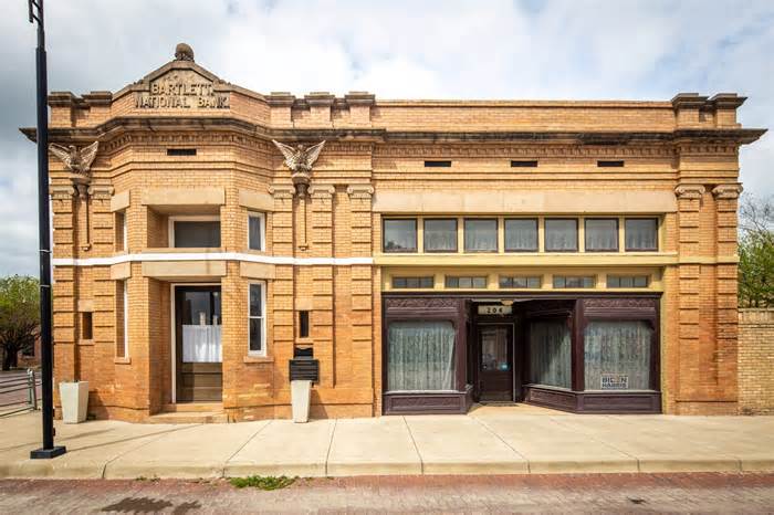 A 119-year-old bank sat abandoned in a tiny Texas town for decades. Now it's a 3-bedroom home with the original vaults and a teller station — take a look.