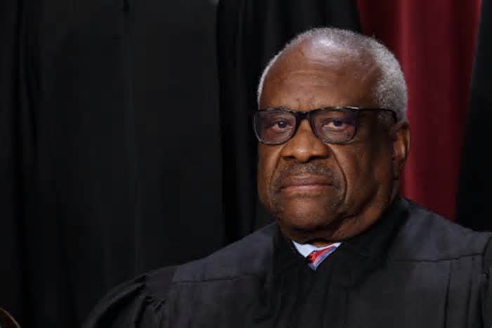 Associate US Supreme Court Justice Clarence Thomas poses for the official photo at the Supreme Court in Washington, DC on October 7, 2022