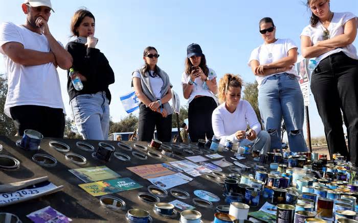Candles are lit in memory of young people killed by Hamas terrorists at the Supermova music festival on October 7, 2023. Many young women were raped and mutilated before being killed