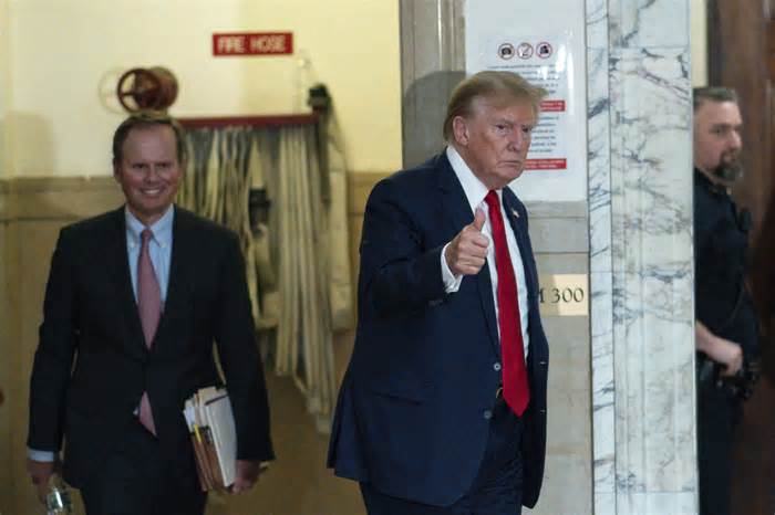 Former President Donald Trump gives a thumbs up as he returns to the courtroom from a break at New York Supreme Court, Thursday, Dec. 7, 2023, in New York. (AP Photo/Eduardo Munoz Alvarez)