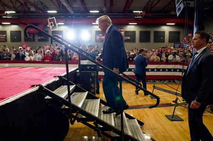Republican presidential candidate former President Donald Trump arrives to speak at a commit to caucus rally, Saturday, Jan. 6, 2024, in Clinton, Iowa. (AP Photo/Charlie Neibergall)