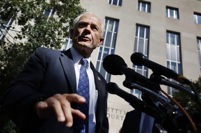 Former Trump White House Advisor Peter Navarro talks briefly with reporters after appearing in federal district court for a motion hearing at the Prettyman Courthouse on August 31, 2022 in Washington, DC. Navarro has been indicted by a grand jury on two counts of contempt of Congress.