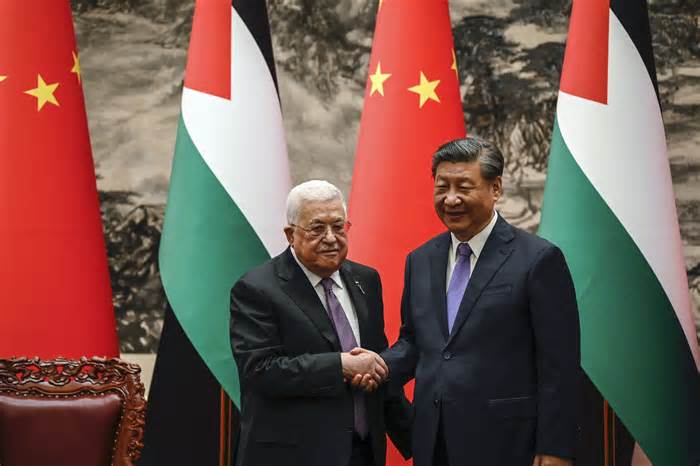 Chinese President Xi Jinping and his Palestinian counterpart, Mahmoud Abbas, shake hands after a signing ceremony in Beijing in June.