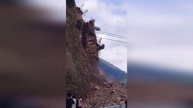 Terrifying landslide buries highway as motorists dodge falling rubble Thumbnail