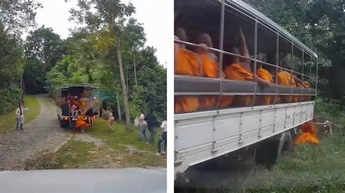 Overloaded truck full of Buddhist monks crashes into ditch