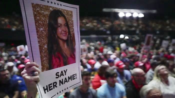 A supporter holds poster with a photo of Laken Riley before Republican presidential candidate former President Donald Trump speaks at a campaign rally Saturday, March 9, 2024, in Rome Ga. (AP Photo/Mike Stewart) - Mike Stewart/AP