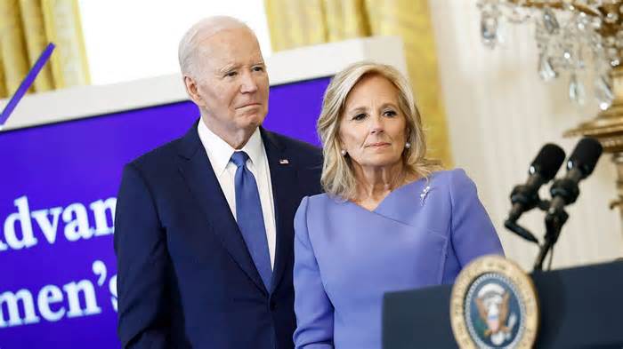 President Joe Biden and first lady Jill Biden listen as Maria Shriver, the former first lady of California, speaks during a Women’s History Month reception in the East Room of the White House on March 18, 2024 in Washington, DC.