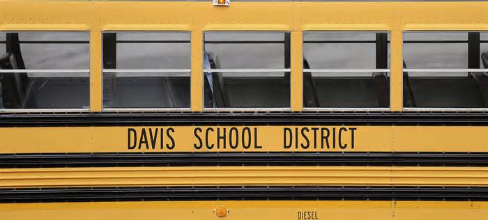 A Davis School District bus sits at the Bus Farm in Farmington, Utah, in this undated photo. A Black woman hired by the northern Utah school district to investigate racial harassment complaints a year after a 10-year-old Black student died by suicide says that she, too, experienced discrimination from district officials. Joscelin Thomas, a former coordinator in the Davis School District's equal opportunity office, alleges in a federal lawsuit that district administrators treated her “as if she were stupid,