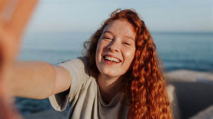 Smiling girl with red hair selfie