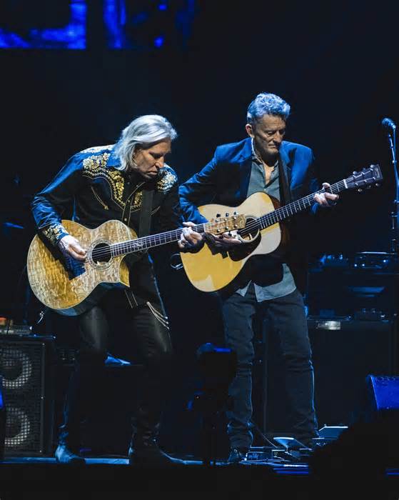 Joe Walsh and guitarist Stuart Smith perform with the Eagles at the Kia Forum on Jan. 5.