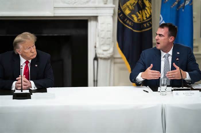 Then-President Donald Trump and Oklahoma Gov. Kevin Stitt (R) in a roundtable discussion at the White House in June 2020.