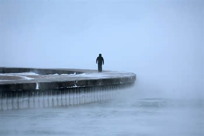 Man walking along Lake Michigan