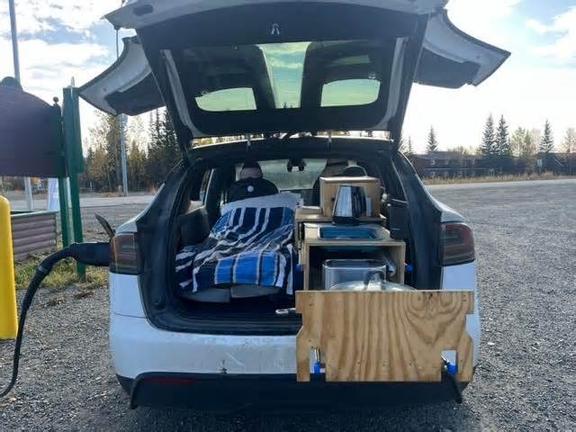 A Tesla owner built a bed and make-shift kitchen for his Model X and lived in his electric car for a year, traveling to 49 states