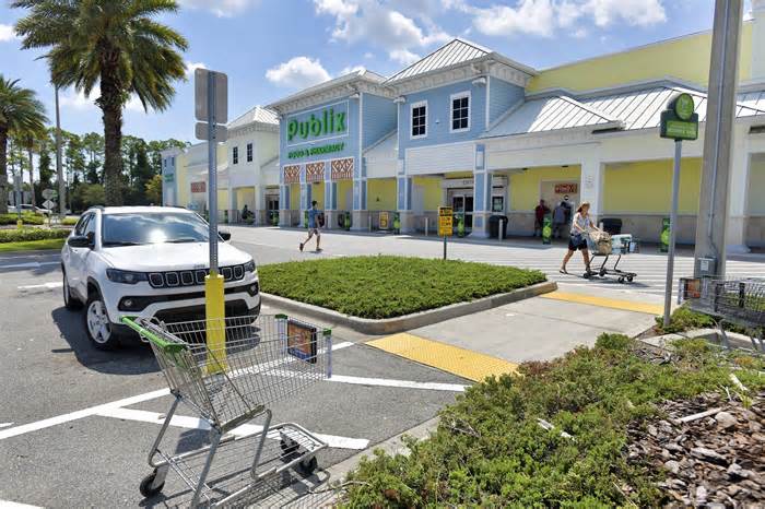 It wasn't quite business as usual at the Publix at 630 Atlantic Blvd. in Neptune Beach Wednesday as shoppers made their way in and out of the store, Many people were talking and joking about the winning $1.58 billion Mega Millions ticket that was sold there. 
