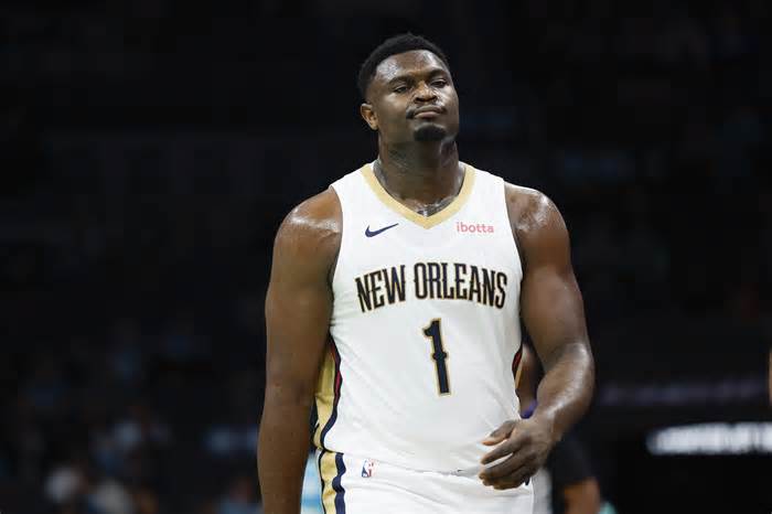 Dec 15, 2023; Charlotte, North Carolina, USA; New Orleans Pelicans forward Zion Williamson (1) walks to the bench during the first quarter against the Charlotte Hornets at Spectrum Center. Mandatory Credit: Nell Redmond-USA TODAY Sports