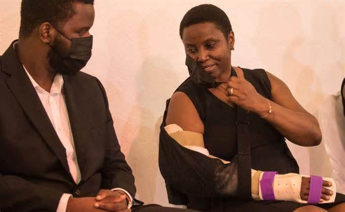 Martine Moïse (speaking to her son) was injured in the attack in which her husband was killed