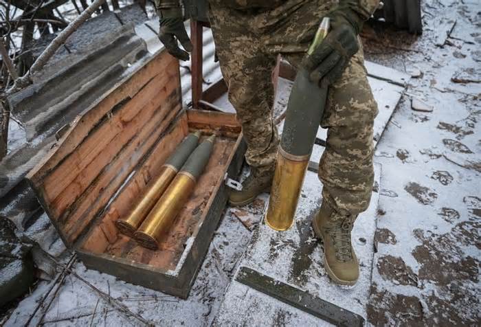 Ukrainian serviceman prepares shells to fire a L119 howitzer towards Russian at a position near Bakhmut