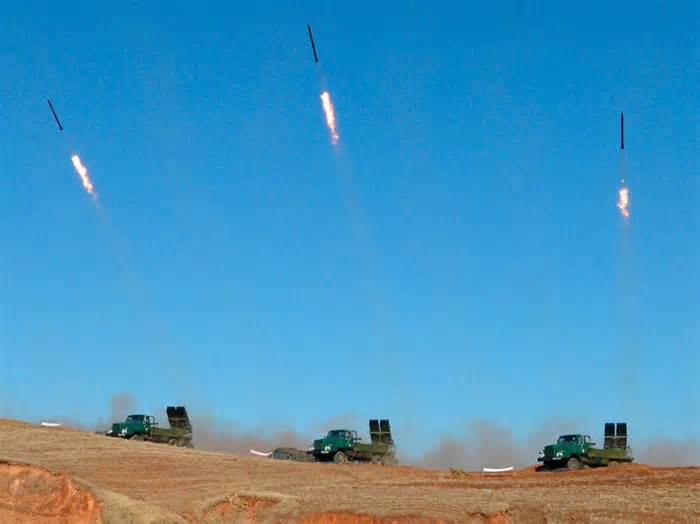 North and South Korea fire hundreds of artillery shells along tense sea border