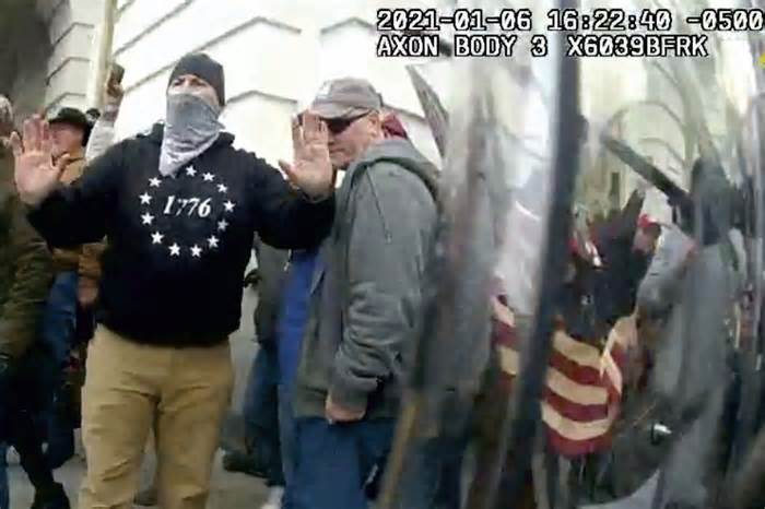 This image from police body-worn video and contained in the Justice Department statement of facts supporting the arrest of Frank Dahlquist, shows Dahlquist outside the U.S. Capitol on Jan. 6, 2021, in Washington. Dahlquist was charged Wednesday, Jan. 10, 2024, with spraying a chemical irritant on police officers during the riot at the U.S. Capitol. (Department of Justice via AP)