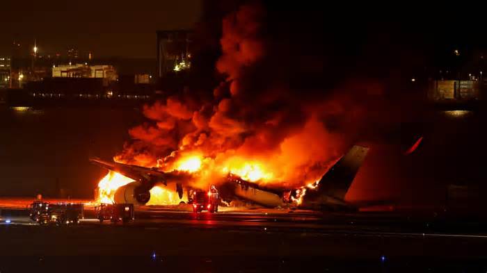 Japan Airlines plane on fire on runway at Japanese airport
