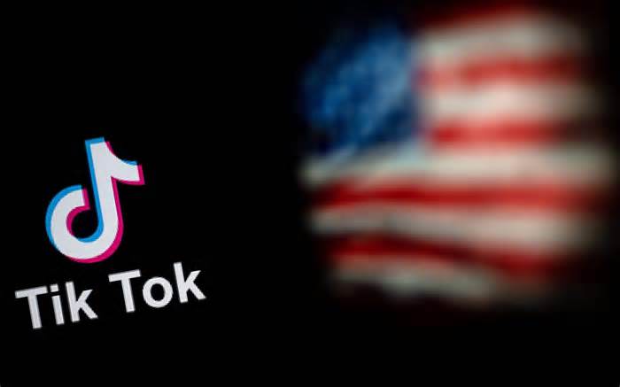 logo of the social network application TikTok (L) and a US flag (R)