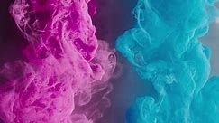 Ink splash. Paint water. Thunderstorm cloud. Bright magenta pink blue color smoke cloud with flash light effect abstract art background shot on RED.