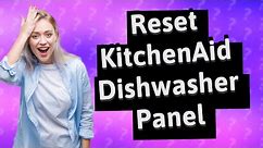 How do you reset the control panel on a KitchenAid dishwasher?