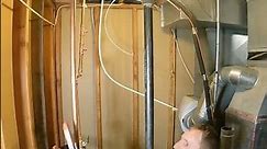 Removing two water heaters and installing a single 50 gal Bradford White.