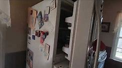 How should a refrigerator door close