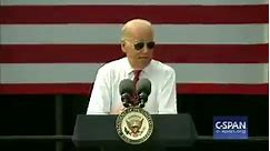 Biden slips on his Ray-Ban sunglasses