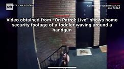 Video: Neighbors call police after seeing toddler waving gun, pulling trigger
